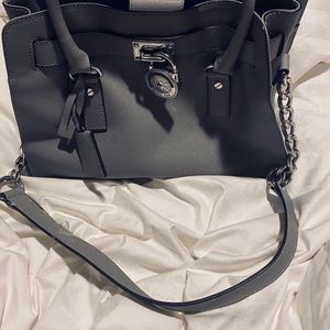 Michael Kors light gray purse.